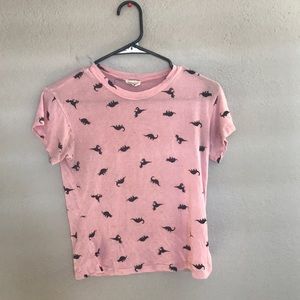 A pink dinosaur short sleeve shirt